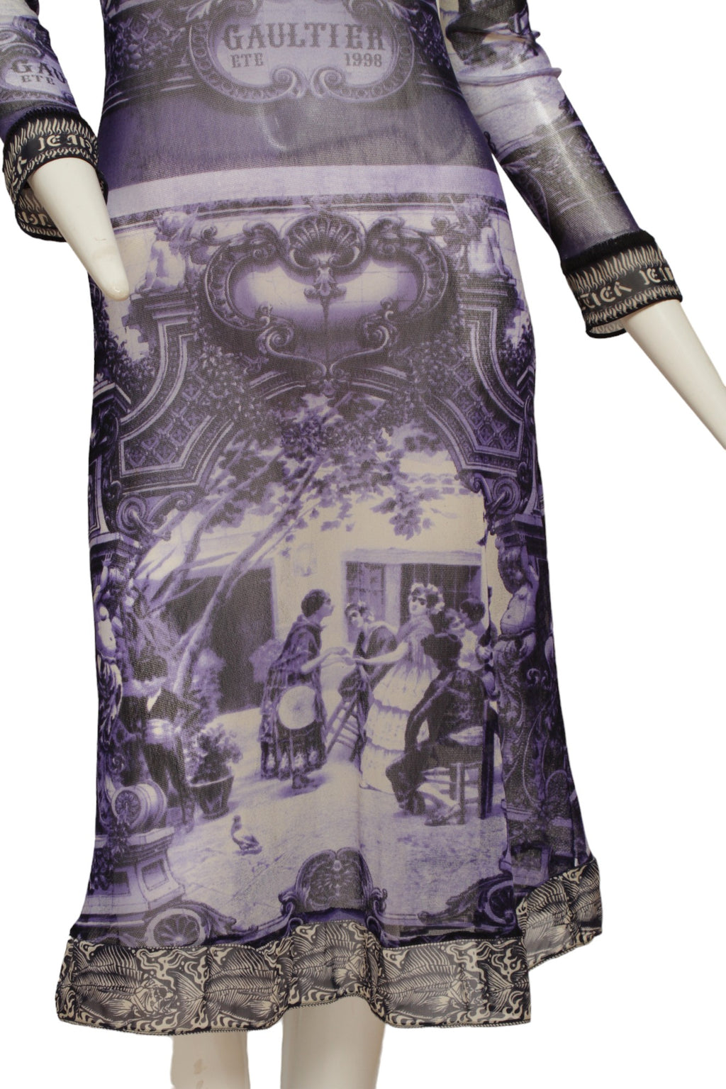 JEAN PAUL GAULTIER, French courtyard scene, long blue and white dress with black and white ruffle hem, Été (Summer) 1998