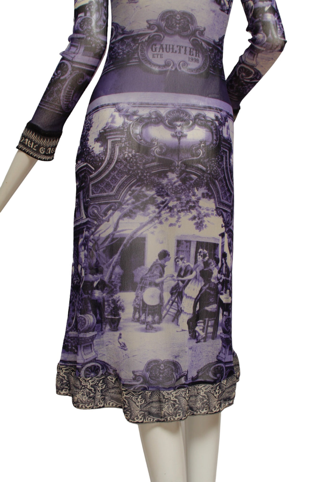 JEAN PAUL GAULTIER, French courtyard scene, long blue and white dress with black and white ruffle hem, Été (Summer) 1998