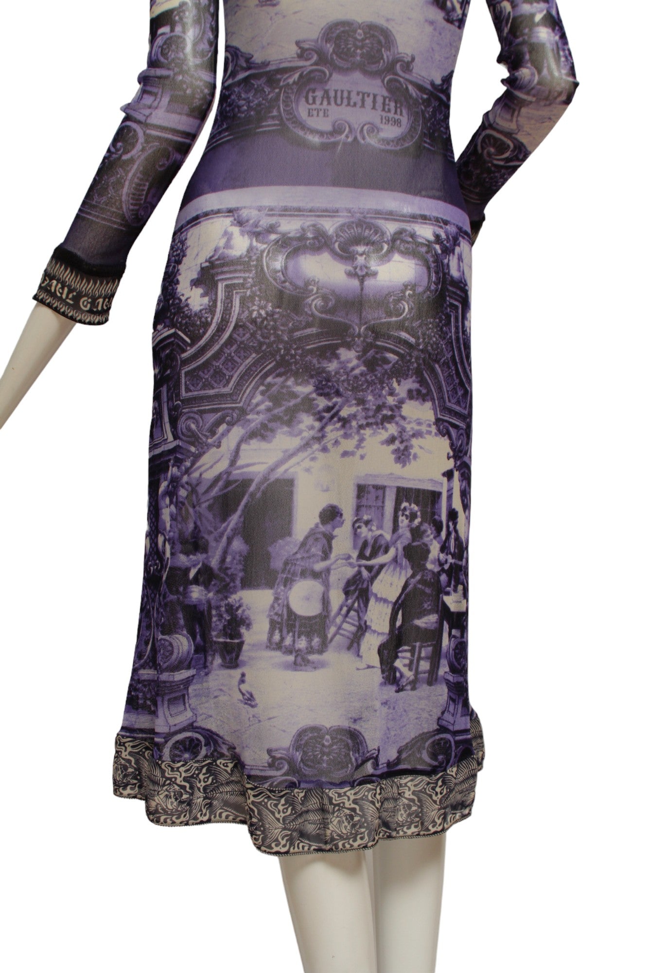 JEAN PAUL GAULTIER, French courtyard scene, long blue and white dress with black and white ruffle hem, Été (Summer) 1998