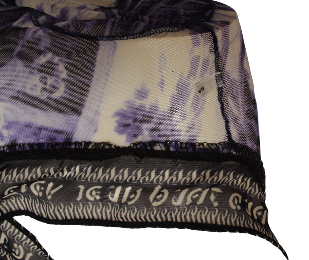 JEAN PAUL GAULTIER, French courtyard scene, long blue and white dress with black and white ruffle hem, Été (Summer) 1998